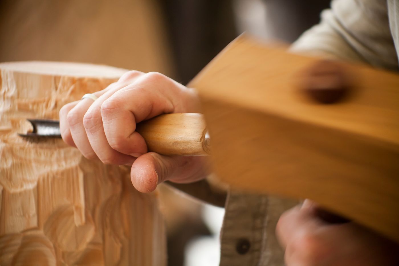 Hand carving timber with a chisel