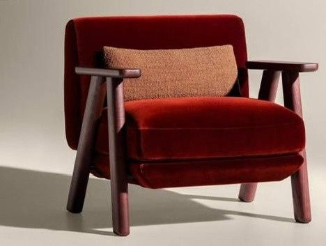 Red velvet armchair with timber frame